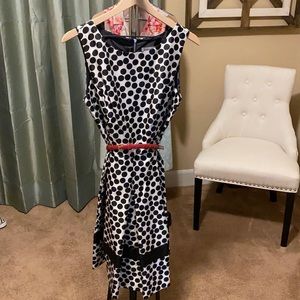- Black and white dress with red belt